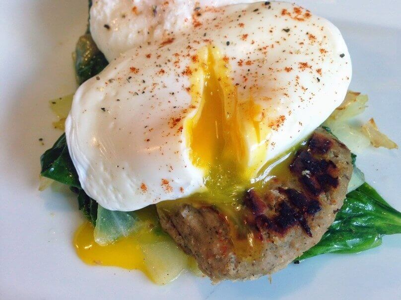 Poached Eggs Over Turkey Sausage and Wilted Spinach