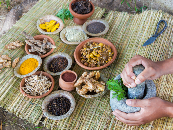 An assorment of ayurvedic herbs on a table