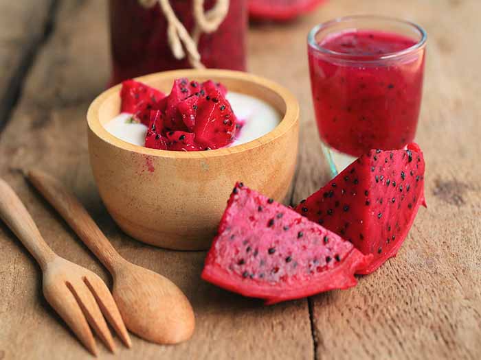 Red dragon fruit served as juice, sliced, and with yogurt