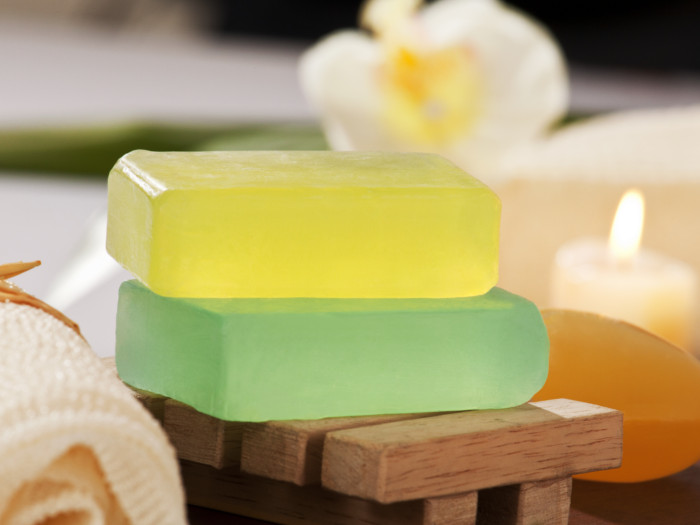 Yellow and green glycerin soaps kept one on top of the other