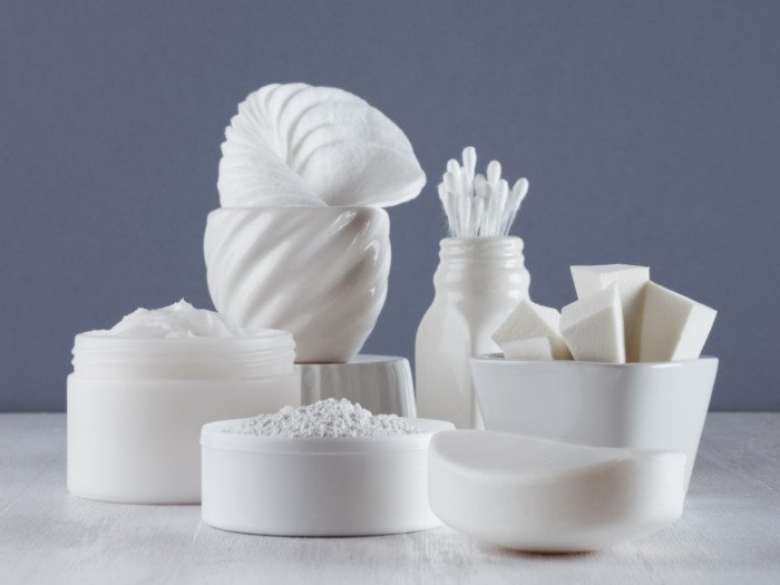 A counter top full of bathroom supplies in white color