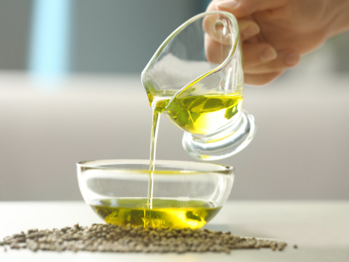 Brominated vegetable oil being poured into a glass bowl