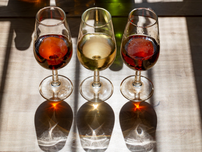 Sherry in different wine glasses on a counter