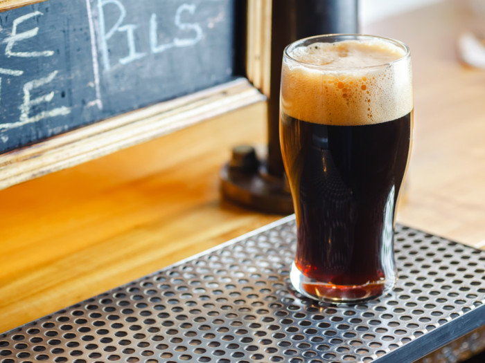 A glass of stout beer on a table