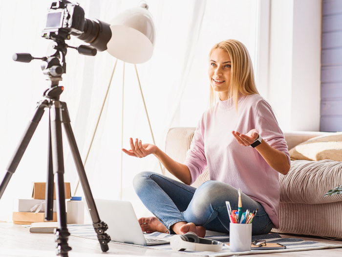 Female influencer making a video